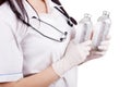 Hands girls doctor wearing rubber gloves with a vaccine in glass bottles. Royalty Free Stock Photo