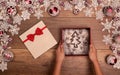 Hands giving or receiving christmas present - in seasonal decorations frame Royalty Free Stock Photo