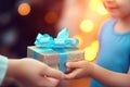 Hands giving and receiving present. Male and female hands holding gift box on blurred background Royalty Free Stock Photo