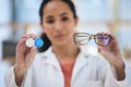 Hands, glasses and contact lens, woman with choice of eye care and help with optometry, vision and healthcare closeup