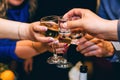 Hands with glasses of wine and vodka friends celebrate Royalty Free Stock Photo