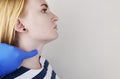 The doctor examines the thyroid gland of a girl. Hands in gloves feel the cartilaginous protrusion of the larynx Royalty Free Stock Photo