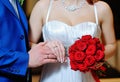 Hands with gold wedding rings bride and groom on the background Royalty Free Stock Photo