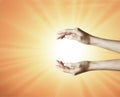 Hands grabbing the sun between, holding a dream, spark of hope, the light of faith background Royalty Free Stock Photo