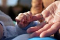 Hands grandmother and baby