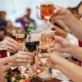 Hands of a group of friends clinking glasses of wine and toasting Royalty Free Stock Photo