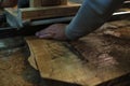 Hands guide wood through a bandsaw, showcasing the art of fine woodworking. It& x27;s a blend of control and Royalty Free Stock Photo