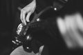hands of a guitarist, a musician plays the bass guitar Royalty Free Stock Photo