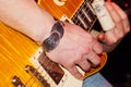 Hands of the guitarist playing the guitar close -up Royalty Free Stock Photo