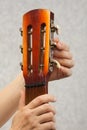 Hands of guitarist tuning acoustic guitar Royalty Free Stock Photo