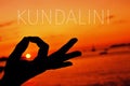 Hands in gyan mudra and text kundalini