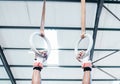 Hands, gymnastics ring and person in fitness for workout, strength training or competition. Closeup of hanging athlete