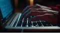 Hands of a hacker on the keyboard of a laptop in the dark Royalty Free Stock Photo