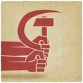 Hands with hammer and sickle old background Royalty Free Stock Photo