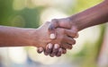 Hands, handshake and friendship in trust, support or care for relationship, agreement or unity against bokeh background Royalty Free Stock Photo