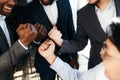 Hands of happy businessmen in suits clenched into fists celebrating victory in negotiations Royalty Free Stock Photo