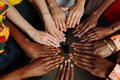 Hands of happy group of multinational African, latin american and european people which stay together in circle Royalty Free Stock Photo