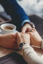 Hands of happy loving couple in a restaurant Royalty Free Stock Photo