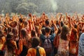 Hands and happy people crowd partying under rain at holi fest, f Royalty Free Stock Photo