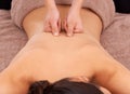 Hands, health and woman with back massage at spa for wellness, self care and grooming treatment. Skin, calm and female