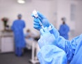 Hands, healthcare and syringe with a doctor in scrubs at the hospital for treatment of disease. Medical, injection and Royalty Free Stock Photo