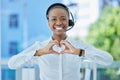 Hands, heart and call center consultant with black woman happy, smile and excited about customer service excellence Royalty Free Stock Photo