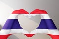 hands in heart gesture painted in flag thailand