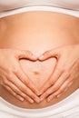 Hands heart simbol pregnant abdomen Royalty Free Stock Photo