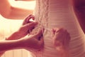 Hands helping the bride with her wedding dress Royalty Free Stock Photo