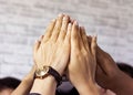 Selective focus of hands in hi five team work which hands of team , the business Unity and teamwork concept