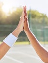 Hands, high five and people on a tennis court with motivation, success and partnership. Closeup of support, unity and