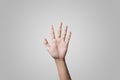 Hands high up on gray background. Royalty Free Stock Photo