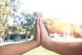 Hands hit and bumping together with sun light on sky background.After work doing something success Royalty Free Stock Photo