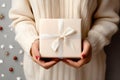 Hands hold a beautiful gift box with a ribbon and white tulips, Gift Giving, Surprise Gift - Ai Generated