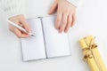 Hands hold an blank notebook among gift box Royalty Free Stock Photo