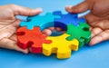 Hands hold colorful puzzle pieces,symbolizing collaboration and unity,DEI theme