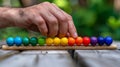 Hands hold Colorful wood abacus