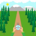 Hands hold a compass on forest road. Terrain orientation concept.