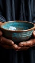 Hands hold empty bowl, portraying the harshness of hunger and economic hardship Royalty Free Stock Photo