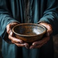 Hands hold empty bowl, portraying the harshness of hunger and economic hardship Royalty Free Stock Photo