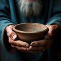 Hands hold empty bowl, portraying the harshness of hunger and economic hardship Royalty Free Stock Photo