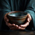 Hands hold empty bowl, portraying the harshness of hunger and economic hardship Royalty Free Stock Photo