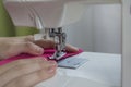 Hands hold the fabric. sewing machine sewing thread Royalty Free Stock Photo