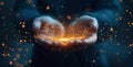 Hands hold glowing particles creating a magical effect in a dark setting Royalty Free Stock Photo