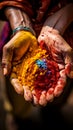 Hands hold a handful of Holi powder colors for the festival