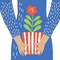 Hands hold a pot with a red flower vector illustration
