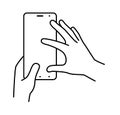 Hands hold smartphone vertically, finger touching the screen. Illustration on a white background. Vector line icons Royalty Free Stock Photo