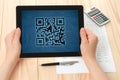 Hands hold tablet PC with QR code Royalty Free Stock Photo