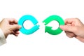 Hands holding arrow infinity jigsaw puzzle pieces, Circular economy concept