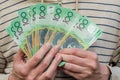 Hands holding australian dollars 100 banknotes. Finance and payment Royalty Free Stock Photo